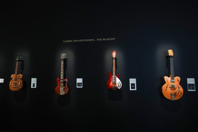 afp-20260206-96cm6hq-v1-midres-guitarsofkurtcobainjohnlennonprincedavidgilmouro